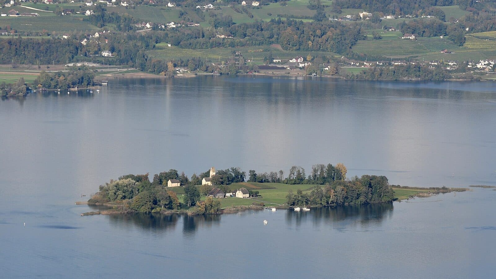 View across Lake Zurich near Feldbach toward Ufenau and Etzel